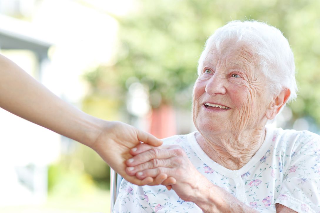 Elderly shaking hands