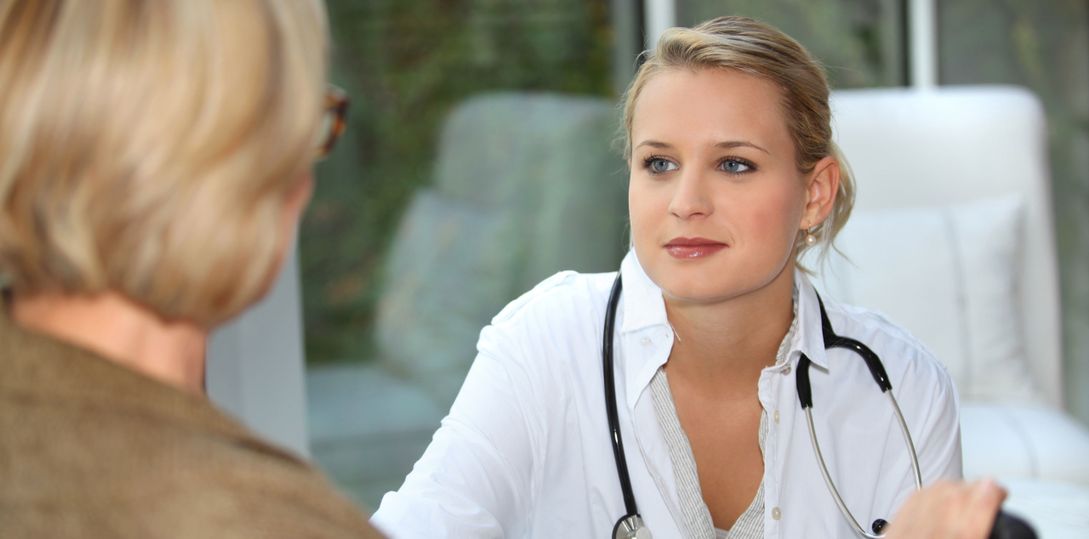 Nurse listening to her patient