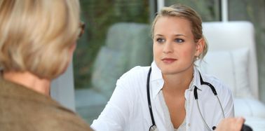 Nurse listening to patient