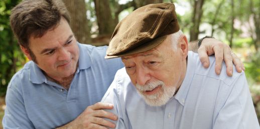 Elderly gentleman being aided by a healthcare