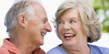 Elderly couple laughing